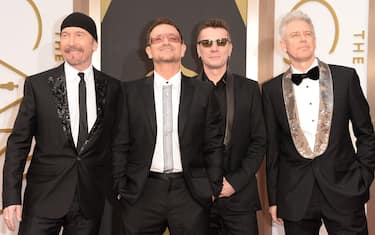 HOLLYWOOD, CA - MARCH 02:  (L-R) Musicians The Edge, Bono, Larry Mullen Jr. and Adam Clayton of U2 attend the Oscars held at Hollywood & Highland Center on March 2, 2014 in Hollywood, California.  (Photo by Jason Merritt/Getty Images)