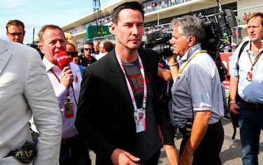 AUSTIN, TX - NOVEMBER 02:  Actor Keanu Reeves walks along the grid before the United States Formula One Grand Prix at Circuit of The Americas on November 2, 2014 in Austin, United States.  (Photo by Mark Thompson/Getty Images)