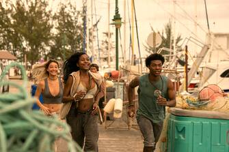 Outer Banks.  (L to R) Madelyn Cline as Sarah Cameron, Carlacia Grant as Cleo, Jonathan Daviss as Pope in episode 302 of Outer Banks.  Cr.  Jackson Lee Davis/Netflix © 2023