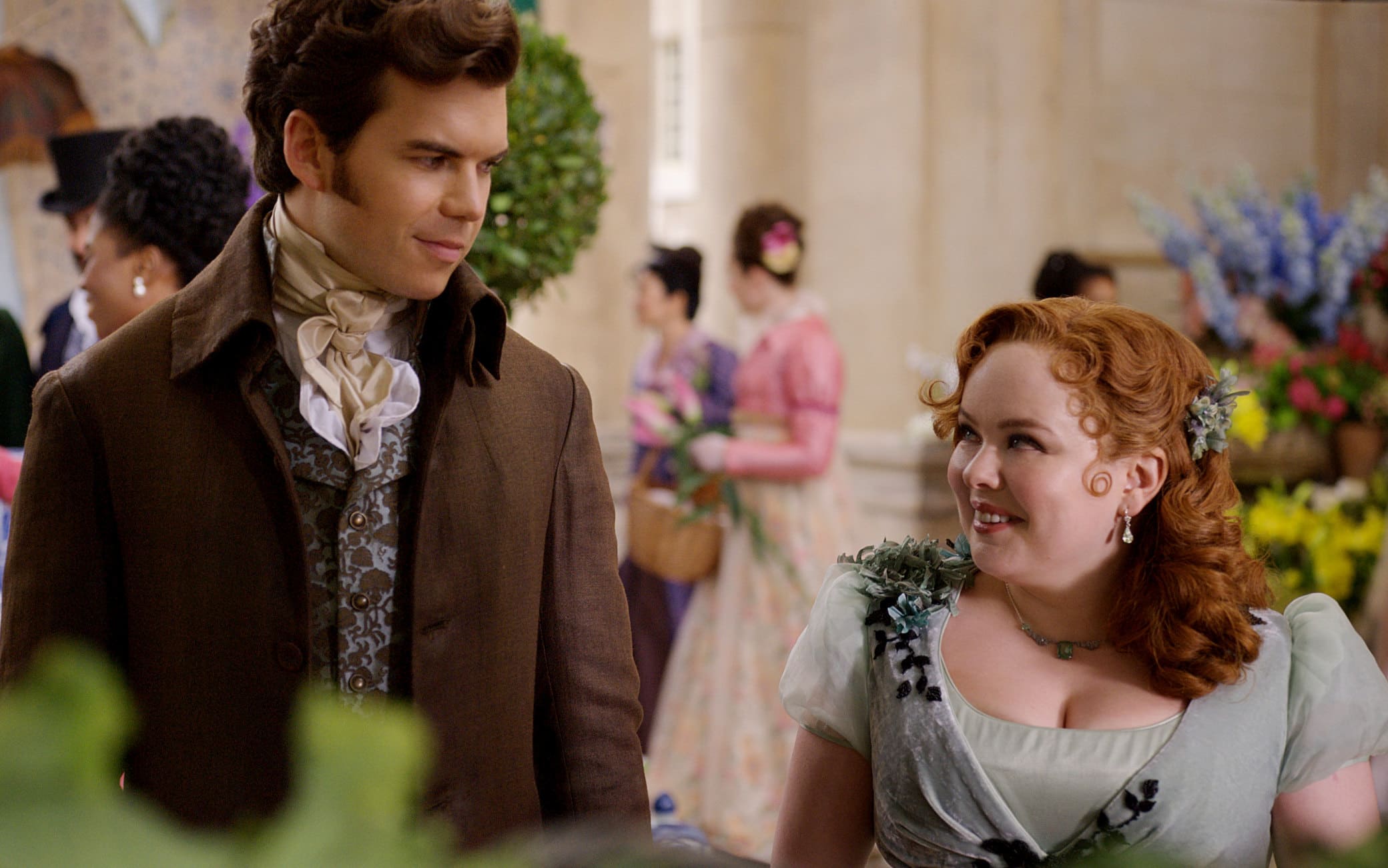 Bridgerton. (L to R) Luke Newton as Colin Bridgerton, Nicola Coughlan as Penelope Featherington in episode 10 of Bridgerton. Cr. Courtesy of Netflix © 2023