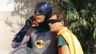 Burt Ward, US actor, and Adam West, US actor, both in costume as the 'Dynamic Duo' in a publicity still issued for the television series, 'Batman', USA, circa 1966. The television series featuring DC Comics characters, starred West as 'Bruce Wayne' and his alter ego 'Batman', and Ward as 'Dick Grayson' and his alter ego 'Robin'. (Photo by Silver Screen Collection/Getty Images)
