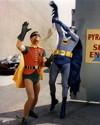 Burt Ward, US actor, and Adam West, US actor, both in costume as the 'Dynamic Duo' in a publicity still issued for the television series, 'Batman', USA, circa 1966. The television series featuring DC Comics characters, starred West as 'Batman', and Ward as 'Robin'. (Photo by Silver Screen Collection/Getty Images)