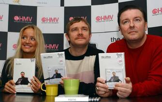 Stars of the BBC2 show The Office, from left to right; Lucy Davis, Martin Freeman and Ricky Gervais during the launch of the DVD of the first series at HMV in Oxford Street, London.   (Photo by Yui Mok - PA Images/PA Images via Getty Images)