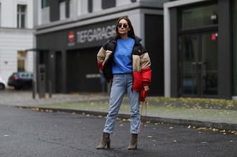 BERLIN, GERMANY - NOVEMBER 19: Anna Schürrle wearing Burberry puffer jacket, Gianvito Rossi boots, Thome Browne shades and Citizens of Humanity jeans, blue Vogue sweater and red leather mini Bottega Veneta bag on November 19, 2020 in Berlin, Germany. (Photo by Jeremy Moeller/Getty Images)