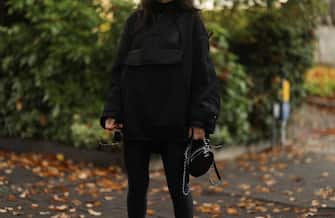 HAMBURG, GERMANY - NOVEMBER 13: Semra Hunt wearing round black leather Chanel bag, Dior cape on November 13, 2020 in Hamburg, Germany. (Photo by Jeremy Moeller/Getty Images)