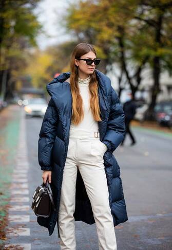 BERLIN, GERMANY - NOVEMBER 01: Jacqueline Zelwis is seen wearing navy puffer coat Max Mar, Otto d'Ame turtleneck in creme white, Sezane pants, checkered bag in black and white Salvatore Ferragamo, Gigi Studios sunglasses on November 01, 2020 in Berlin, Germany. (Photo by Christian Vierig/Getty Images)