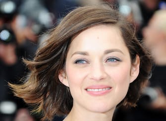 169104272 CANNES, FRANCE - MAY 20: Actress Marion Cotillard attends the photocall for 'Blood Ties' at The 66th Annual Cannes Film Festival on May 20, 2013 in Cannes, France. (Photo by Pascal Le Segretain/Getty Images)