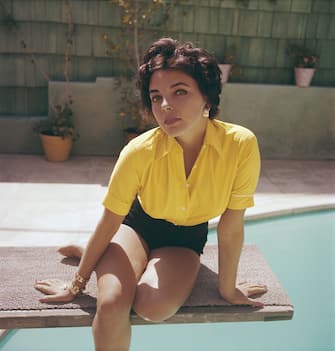 English actress Joan Collins wearing a yellow blouse and shorts, circa 1960. (Photo by Archive Photos/Getty Images)