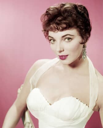 English actress Joan Collins in a white evening dress, circa 1955. (Photo by Silver Screen Collection/Getty Images)