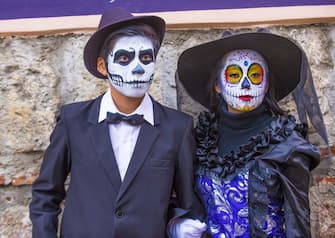 Participants on a carnival of the Day of the Dead in Oaxaca, Mexico. (Photo by: Kobby Dagan/VW Pics/Universal Images Group via Getty Images)