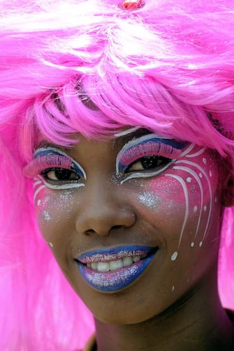 Carnival groups delight the thronging crowds with their multicolored costumes and the frenetic rhythm of their music. (Photo by philippe giraud/Corbis via Getty Images)