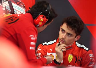 BARCELONA, SPAIN - FEBRUARY 19: Charles Leclerc of Monaco and Ferrari talks with an engineer in the garage during day one of Formula 1 Winter Testing at Circuit de Barcelona-Catalunya on February 19, 2020 in Barcelona, Spain. (Photo by Charles Coates/Getty Images)