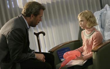 HOUSE:  House (Hugh Laurie, L) bonds with the daughter of a patient (Elle Fanning, L) in the HOUSE episode "Need to Know" airing Tuesday, Feb. 7 (9:00-10:00 PM ET/PT) on FOX.  ©2005 Fox Broadcasting Co.  Cr:  Isabella Vosmikova/FOX