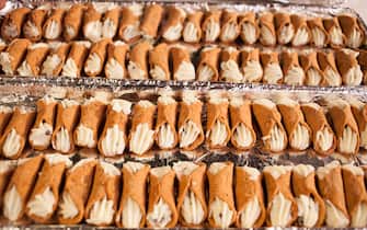 View of a tray of cannoli (or, improperly, cannolis) on display during the Chocolate Expo at the Cradle of Aviation Museum, Garden City, New York, December 11, 2016. (Photo by Chuck Fishman/Getty Images)