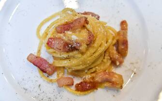 A view of the traditional famous Italian pasta dish "spaghetti alla carbonara", is taken during a preview for the press on April 5, 2019, one day before the international event Carbonara Day (#CarbonaraDay) in Rome. - The preview consists of three teams of cooking students challenge each other with modified Carbonara dishes, a traditional one, a vegan one and an experimental one. (Photo by Andreas SOLARO / AFP)        (Photo credit should read ANDREAS SOLARO/AFP via Getty Images)