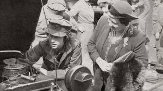 Princess Elizabeth in the A.T.S., seen here with her mother Queen Elizabeth in 1945.  Princess Elizabeth of York, future Elizabeth II,  born 1926. Queen of the United Kingdom.  Queen Elizabeth, The Queen Mother.  Elizabeth Angela Marguerite Bowes-Lyon, 1900 - 2002.  Wife of King George VI and mother of Queen Elizabeth II.(Photo by: Universal History Archive/Universal Images Group via Getty Images)