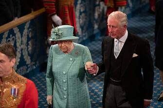 Britain's Queen Elizabeth II and Britain's Prince Charles, Prince of Wales proccess through the Royal Gallery, before the Queen's Speech, during the State Opening of Parliament at the Houses of Parliament in London on December 19, 2019. - The State Opening of Parliament is where Queen Elizabeth II performs her ceremonial duty of informing parliament about the government's agenda for the coming year in a Queen's Speech. (Photo by Matt Dunham / POOL / AFP) (Photo by MATT DUNHAM/POOL/AFP via Getty Images)