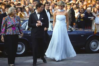 Prince Charles And Princess Diana Arriving At The Cannes Film Festival For A Gala Night In Honour Of  Actor Sir Alec Guinness.  The Princess Is Wearing A Pale Blue Silk Chiffon Strapless Dress With A Matching Chiffon Stole Designed By Fashion Designer Catherine Walker. They Are Greeted By The Lady Mayor Of Cannes.  (Photo by Tim Graham Photo Library via Getty Images)