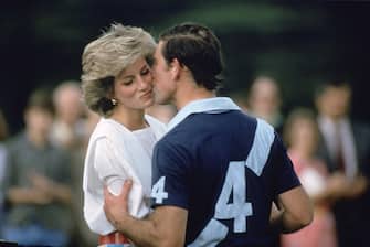 CIRENCESTER, UNITED KINGDOM - JUNE 30:  Prince Charles,The Prince of Wales kissing Princess Diana at prizegiving after a polo match at Cirencester.  (Photo by Tim Graham Photo Library via Getty Images)
