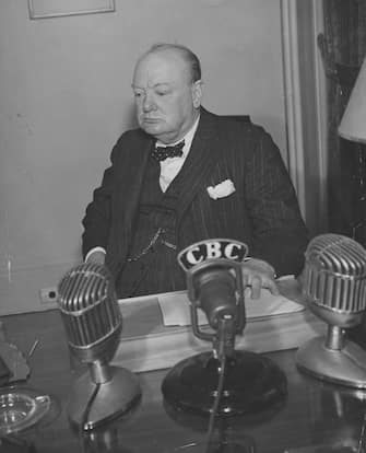 A portrait of Prime Minister Winston Churchill broadcasting to the world from Quebec City, circa August 1941.  (Photo by FPG/Getty Images)