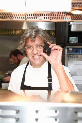 LONDON, ENGLAND - MARCH 05:  Giorgio Locatelli prepares food in the kitchen at Who's Cooking Dinner? 2018, a charity dinner featuring 20 of the capital's finest chefs cooking for 200 diners in aid of leukaemia charity Leuka, at the Rosewood London on March 5, 2018 in London, England.  (Photo by David M. Benett/Dave Benett/Getty Images)