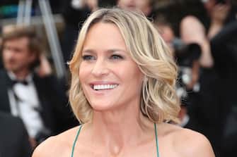 US actress Robin Wright smiles as she arrives on May 18, 2017 for the screening of the film 'Loveless' (Nelyubov) at the 70th edition of the Cannes Film Festival in Cannes, southern France.  / AFP PHOTO / Valery HACHE (Photo credit should read VALERY HACHE / AFP via Getty Images)