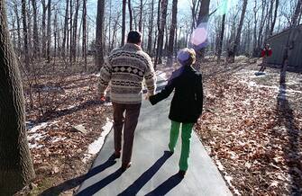 2-14-1981 President and Nancy Reagan walking at Camp David, Maryland