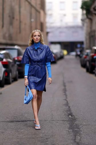 MILAN, ITALY - FEBRUARY 21: Leonie Hanne wears a blue leather dress, a blue turtleneck pullover, a blue bag, blue sandals, outside Sportmax, during Milan Fashion Week Fall/Winter 2020-2021 on February 21, 2020 in Milan, Italy.  (Photo by Edward Berthelot/Getty Images)