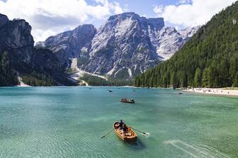 Tourism sailing boat in Lake braies, Dolomite, Italy.