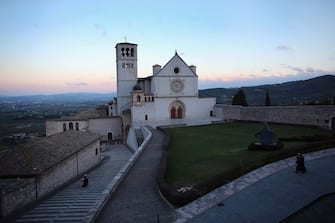 163766378 ASSISI, ITALY - MARCH 15: The Basilica of St. Francis of Assisi which sits above the tomb of Saint Assisi is seen on March 15, 2013 in Assisi, Italy. Cardinal Jorge Mario Begoglio took the name Pope Francis after Saint Francis of Assisi who had renounced a life of privilege, by giving away all his possessions, wearing coarse woolen clothes and living in a humble hut after he took a vow of poverty. (Photo by Joe Raedle/Getty Images)