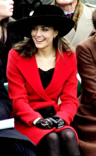 BRITAIN ROYAL GRADUATION Kate Middleton watches from the stands, as graduates of the Royal Military Academy, Sandhurst, including Britain's Prince William, pass out during the Sovereign's parade at the academy, near Camberley, England, Friday Dec. 15, 2006. (AP Photo/Tim Ockenden, pool)