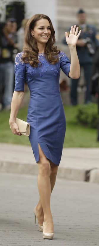 Royal Tour Canada Kate, the Duchess of Cambridge, waves to the crowd after a ceremony at Quebec City Hall as the Royal couple continue their Royal Tour of Canada Sunday, July 3, 2011, in Quebec City, Canada. (AP Photo/Charlie Riedel)
