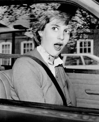 LONDON, UNITED KINGDOM - NOVEMBER 1980: Lady Diana Spencer is startled after stalling her new red Mini Metro outside her Earls Court flat in London just days before her engagement to Prince Charles was announced.  

(Photo by Tom Stoddart/Getty Images)