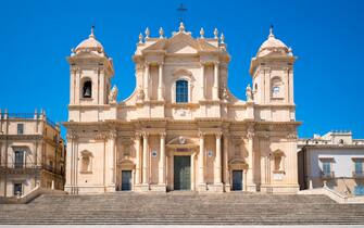 1140983085 NOTO, ITALY: Front elevation and steps of Baroque Cathedral of Saint Nicholas - Basilica di San Nicolo in Noto city, Sicily, Italy.