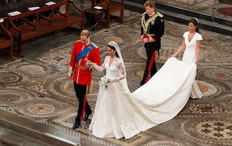 113266935 LONDON, ENGLAND - APRIL 29: Prince William takes the hand of his bride Catherine Middleton, now to be known as Catherine, Duchess of Cambridge, followed by Prince Harry and Pippa Middleton as they walk down the aisle inside Westminster Abbey on April 29, 2011 in London, England. The marriage of Prince William, the second in line to the British throne, to Catherine Middleton is being held in London today. The marriage of the second in line to the British throne is to be led by the Archbishop of Canterbury and will be attended by 1900 guests, including foreign Royal family members and heads of state. Thousands of well-wishers from around the world have also flocked to London to witness the spectacle and pageantry of the Royal Wedding. (Photo by Kirsty Wigglesworth - WPA Pool/Getty Images)