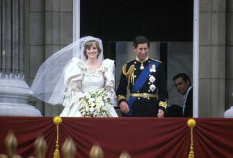 3126204 Prince Charles & Princess Diana (1961 - 1997) stand on the balcony of Buckingham Palace after their wedding ceremony at St. Paul's Cathedral, London, England, July 29, 1981. (Photo by Express Newspapers/Getty Images)