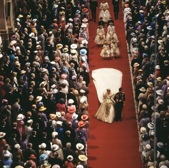 109079957 The wedding of Charles, Prince of Wales, and Lady Diana Spencer in St Paul's Cathedral, London, 29th July 1981. The bride and groom leave the cathedral together after the ceremony. (Photo by Fox Photos/Hulton Archive/Getty Images)