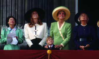 499243542 LONDON, UNITED KINGDOM - SEPTEMBER 15: Princess Margaret, Sarah, Duchess of York, Prince Harry, Diana, Princess of Wales and the Duchess of Kent stand on the balcony of Buckingham Palace to watch The Battle of Britain Anniversary Parade on September 15, 1990 in London, England. (Photo by Anwar Hussein/Getty Images)