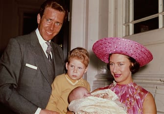 3426604 1964: Princess Margaret (1930 - 2002) with Lord Snowdon and Viscount Linley at Kensington Palace shortly after the birth of her daughter, Lady Sarah Armstrong-Jones. (Photo by Fox Photos/Getty Images)