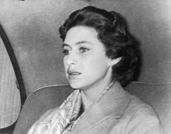 3281701 17th October 1955: A troubled Princess Margaret (1930 - 2002) returns to Clarence House after a weekend in the country where Group Captain Peter Townsend was also a guest. The decision not to marry Townsend was announced 31st October 1955. (Photo by Derek Berwin/Fox Photos/Getty Images)