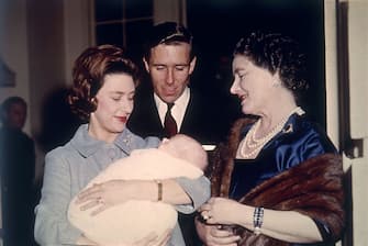 695408 400806 36: (FILE PHOTO) The Queen Mother is introduced to baby David Linley in 1961 by his proud parents Princess Margaret (L) and Lord Snowdon. Buckingham Palace announced that Princess Margaret died peacefully in her sleep at 1:30AM EST at the King Edward VII Hospital February 9, 2002 in London. (Photo by Getty Images)