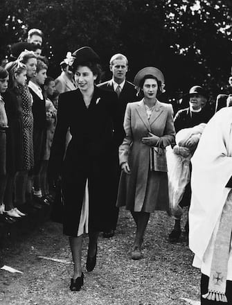 Princess Elizabeth Surrey 1947 Princess Elizabeth, front, and Princess Margaret Rose, who follows, as they attend the christening of six-weeks-old Rosemary Elizabeth, daughter of Hon. Andrew Elphinstone and Mrs. Elphinstone, Sept. 30, 1947, Maryland, Worplesdon, Surrey, England. Princess Elizabeth acted as godmother at the ceremony. Lt. Philip Mountbatten, Princess Elizabeths fiancà , follows the princesses as the group arrives at Parish Church. (AP Photo)