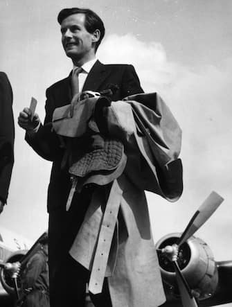 695372 400806 17: (FILE PHOTO) Carrying a saddle, Captain Peter Townsend arrives June 15, 1956 at Malpensa Airport, Milan for the ''Bocconi Trophy''. His name was linked romantically with that of Princess Margarets when he was an equerry to her father George VI, but she was dissuaded from marrying him by the Church and Government in 1955. Buckingham Palace announced that Princess Margaret died peacefully in her sleep at 1:30AM EST at the King Edward VII Hospital February 9, 2002 in London. (Photo by Getty Images)
