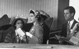 695400 400806 32: (FILE PHOTO) Princess Margaret (L), Princess Elizabeth and Group Captain Peter Townsend gather June 13, 1951 in the Royal Box at Ascot. In 1955 Princess Margaret was refused permission to marry Townsend, a divorced Royal Air Force captain. Buckingham Palace announced that Princess Margaret died peacefully in her sleep at 1:30AM EST at the King Edward VII Hospital February 9, 2002 in London. (Photo by Getty Images)
