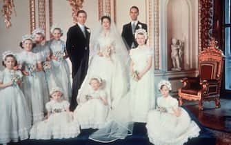 52801706 Princess Margaret and her new husband Antony Armstrong Jones pose for a picture with their bridesmaids at Buckingham Palace, 6th May 1960. (Photo by Hulton Archive/Getty Images)