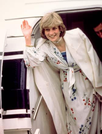 173966267 Prince Charles and Diana, Princess of Wales (1961 - 1997) leave Eastleigh airport in Hampshire at the start of their honeymoon, August 1981. She is wearing a Donald Campbell dress. (Photo by Kypros/Getty Images)