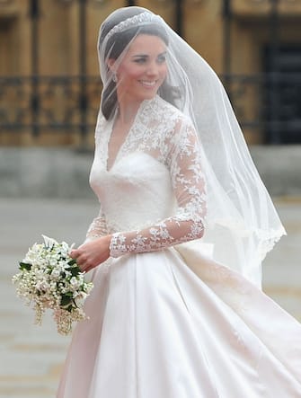 113286941 LONDON, ENGLAND - APRIL 29: Catherine Middleton arrives to attend the Royal Wedding of Prince William to Catherine Middleton at Westminster Abbey on April 29, 2011 in London, England. The marriage of the second in line to the British throne is to be led by the Archbishop of Canterbury and will be attended by 1900 guests, including foreign Royal family members and heads of state. Thousands of well-wishers from around the world have also flocked to London to witness the spectacle and pageantry of the Royal Wedding. (Photo by Pascal Le Segretain/Getty Images)