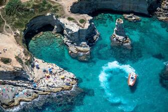 LECCE, ITALY - JULY 20: Aerial view from a helicopter of the coastline of Torre dell'Orso, a seaside resort in Salento on July 20, 2019 in Lecce, Italy.  Italy's nearly 8000 km (5,000 miles) coastlines and islands stretch across the Mediterranean Sea and attract large numbers of both local and foreign tourists during the summer season.  (Photo by Fabrizio Villa / Getty Images)