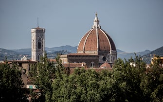 544282208 The Santa Maria del Fiore Cathedral (Cattedrale di Santa Maria del Fiore), also known as the Duomo, and Giottoâ s Campanile, left, are seen from the Giardino di Boboli garden on June 25, 2016 in Florence, Italy. Florence is among Italy's most popular tourist destinations.
