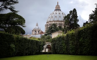 471421532 VATICAN CITY, VATICAN - APRIL 28: A general view of St. Peter's Basilica seen from the Vatican Gardens during the Seminar 'Protect the Earth, Dignify Humanity' Workshopat the Pontifical Academy of Sciences at Casina Pio IV on April 28, 2015 in Vatican City, Vatican. The one day international symposium has been organized by the Pontifical Academy of Sciences and will include a video message to participants from Pope Francis about the Christian imperative of stewardship of creation. (Photo by Giulio Origlia/Getty Images)
